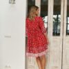 Back view of the Jaase French Ruby Rouge dress, showing the V-neckline and belt of the same fabric