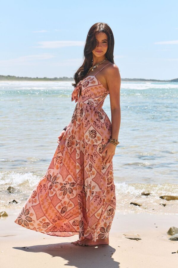 Side view of the Jaase Bambi Tahitian dress showing strap detail and skirt shape