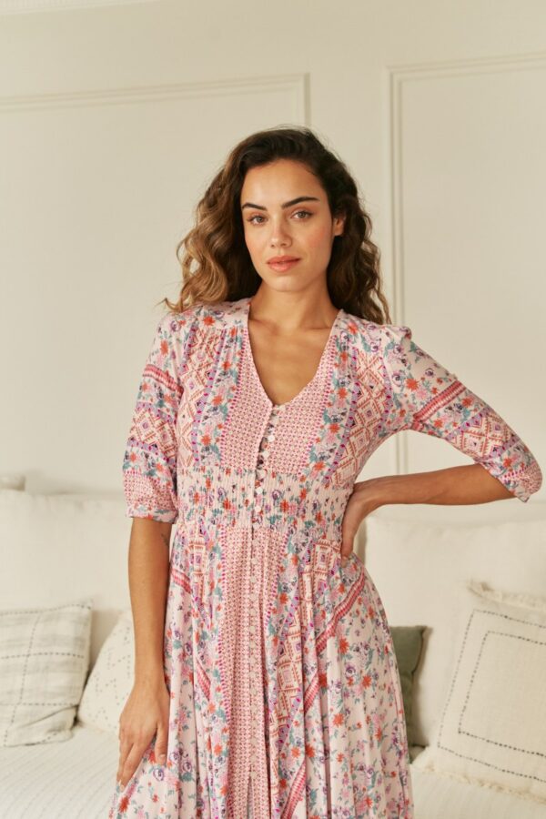 Front view of the Jaase Indiana dress in Nadira print, showing the V-neckline and smocked waist