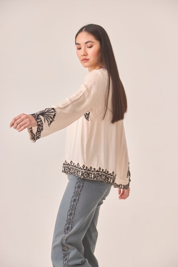 Side view of the boho Mimosa blouse by NKN Nekane