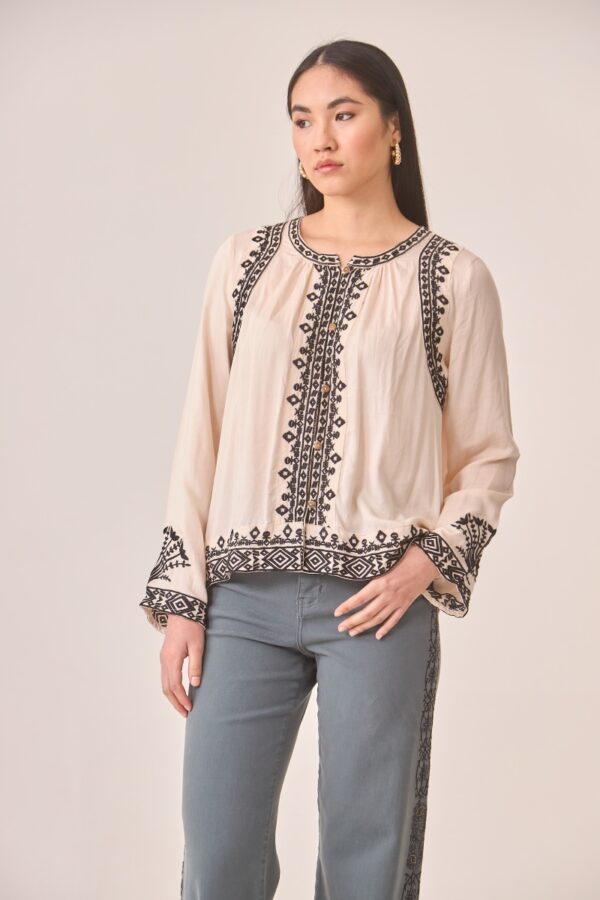 Front view of the embroidered Mimosa blouse by NKN Nekane