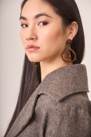 Boho drop earrings with dark metal and garnet central stone